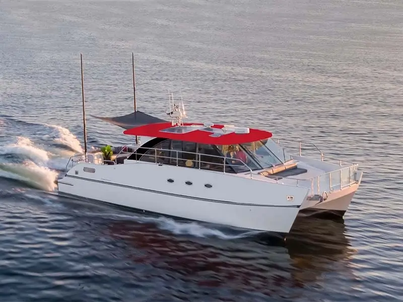 CDLLC - Cup Dynasty Catamaran Outer View On the Water Full Boat